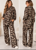 Brown leopard print shirt and trouser co-ord set with hooded collar, model in studio