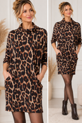 Model wearing a leopard print cowl neck pocket dress in one size