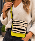 Zebra print recycled leather crossbody bag with lime green body and adjustable strap